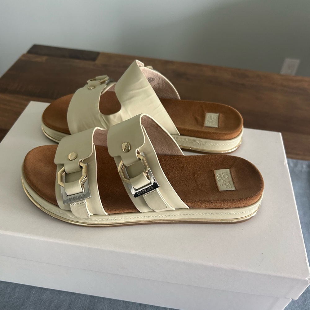 Louise et Cie Cream Slide Sandals with Gold Buckle Accents